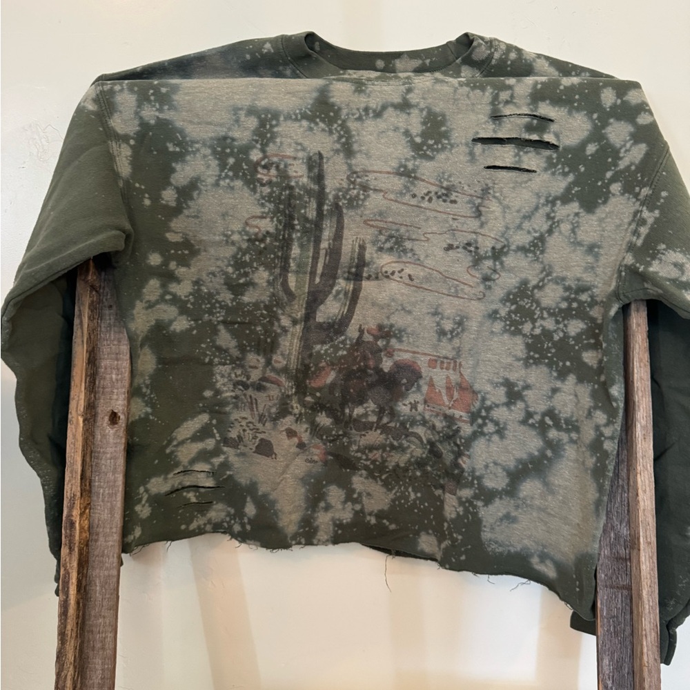 Cropped and distressed crew neck